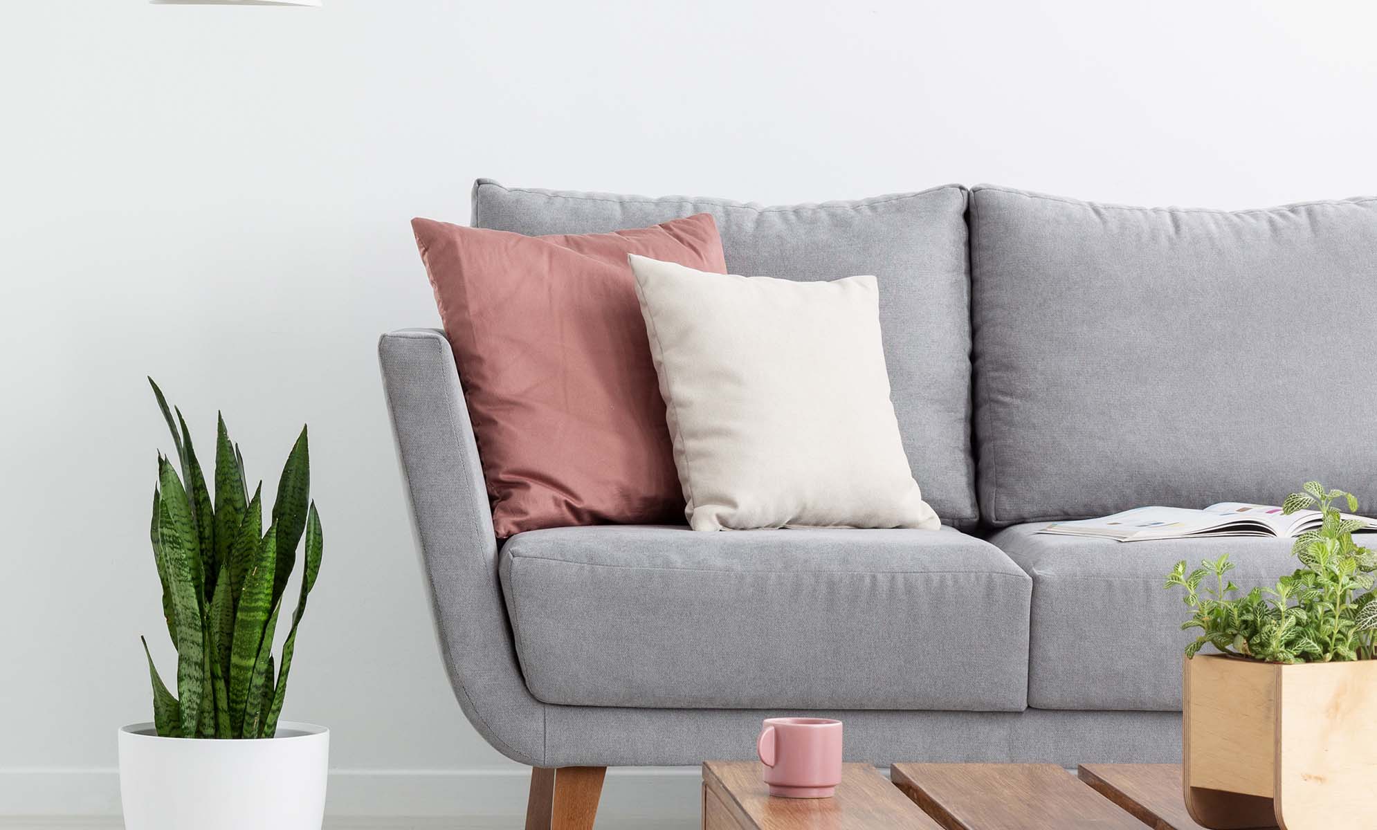 living room with a rattan couch and chair